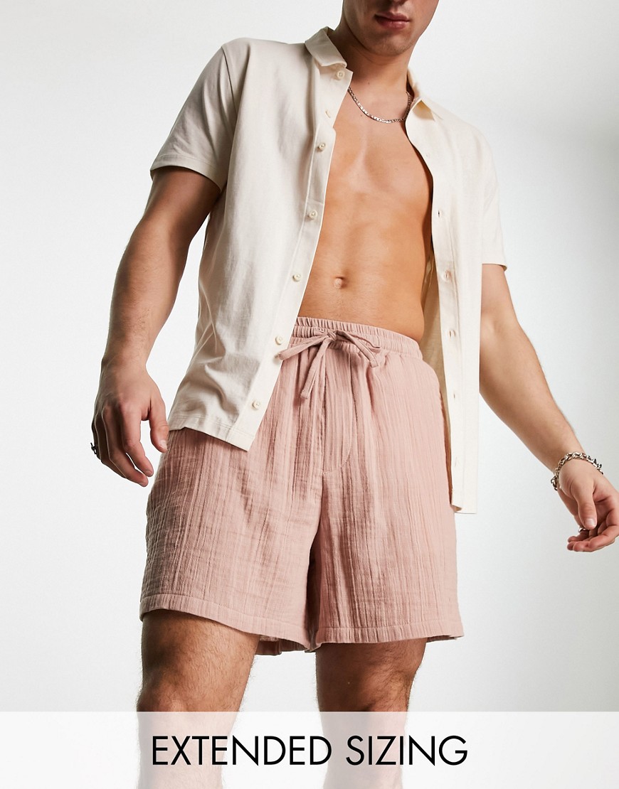 ASOS DESIGN wide textured shorts in shorter length in pink