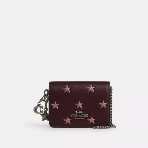 Coach Outlet boxed mini wallet on a chain with star print