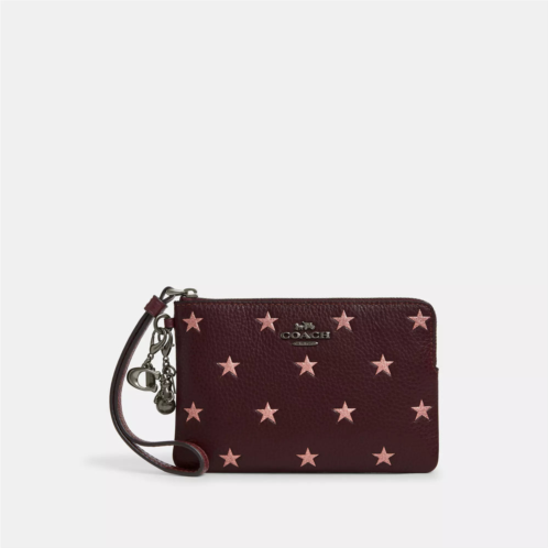 Coach Outlet boxed corner zip wristlet with star print and charms