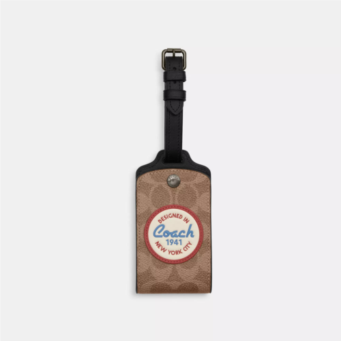 Coach Outlet luggage tag in signature canvas with patches