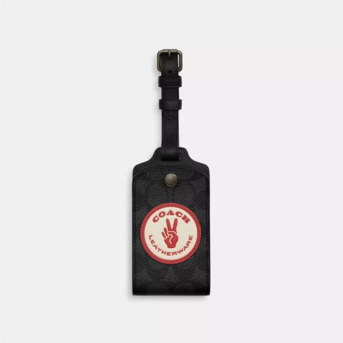 Coach Outlet luggage tag in signature canvas with patches