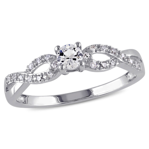 Mimi & Max 1/10ct tw diamond and created white sapphire infinity ring in sterling silver