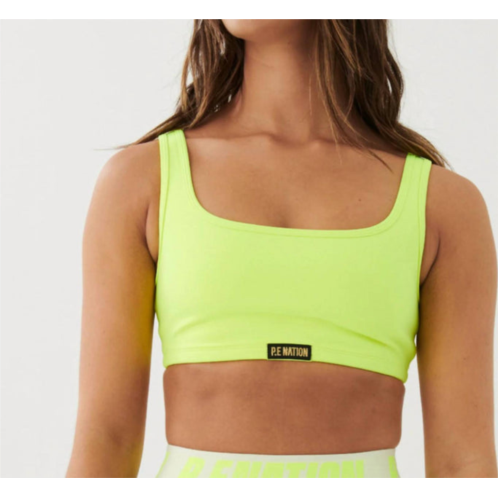 P.E. NATION clubhouse sports bra in safety yellow