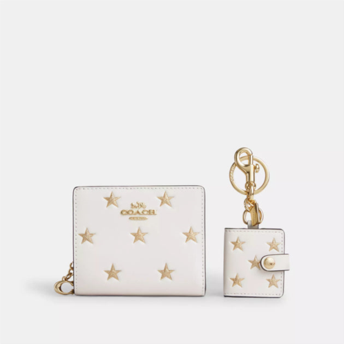 Coach Outlet boxed snap wallet and picture frame bag charm with star print