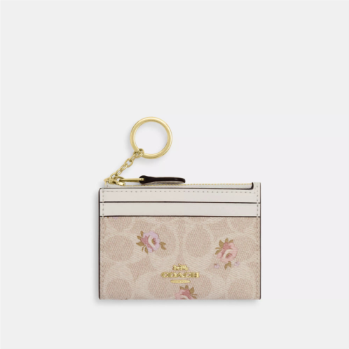 Coach Outlet mini skinny id case in signature canvas with floral print