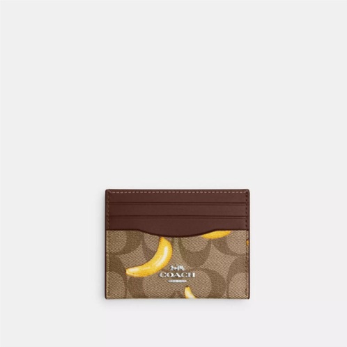 Coach Outlet slim id card case in signature canvas with banana print