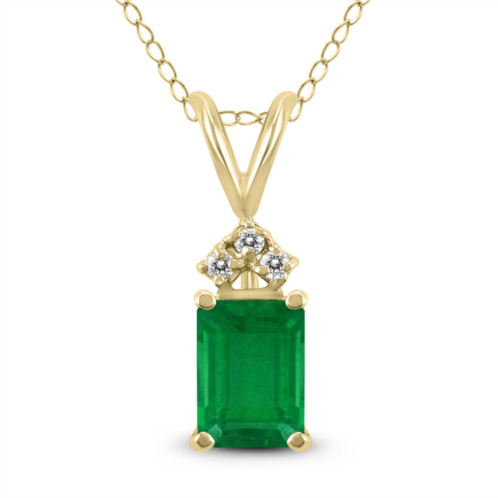 SSELECTS 14k 6x4mm emerald shaped emerald and three stone diamond pendant
