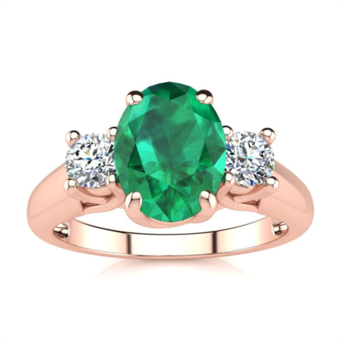 SSELECTS 1 1/3 carat oval shape emerald and two diamond ring in 14 karat rose gold