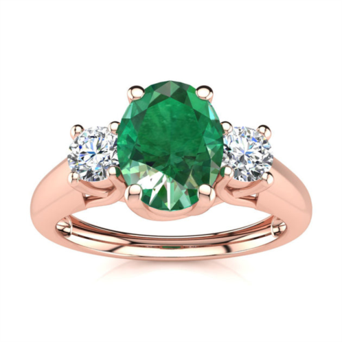 SSELECTS 1 carat oval shape emerald and two diamond ring in 14 karat rose gold
