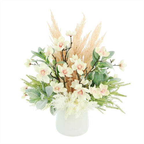 Creative Displays butterfly magnolias, assorted pampas and lambs ear arranged in a glass vase