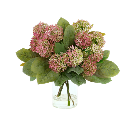 Creative Displays hydrangeas and magnolia leaves arrangement in glass vase with acrylic water