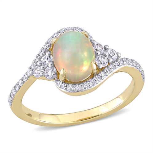 Mimi & Max 1 ct tgw ethiopian yellow opal, white sapphire and 1/5 ct tw diamond oval halo twist ring in 10k yellow gold
