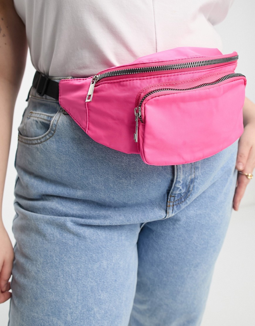 ASOS Curve ASOS DESIGN Curve fanny pack with front pocket in pink