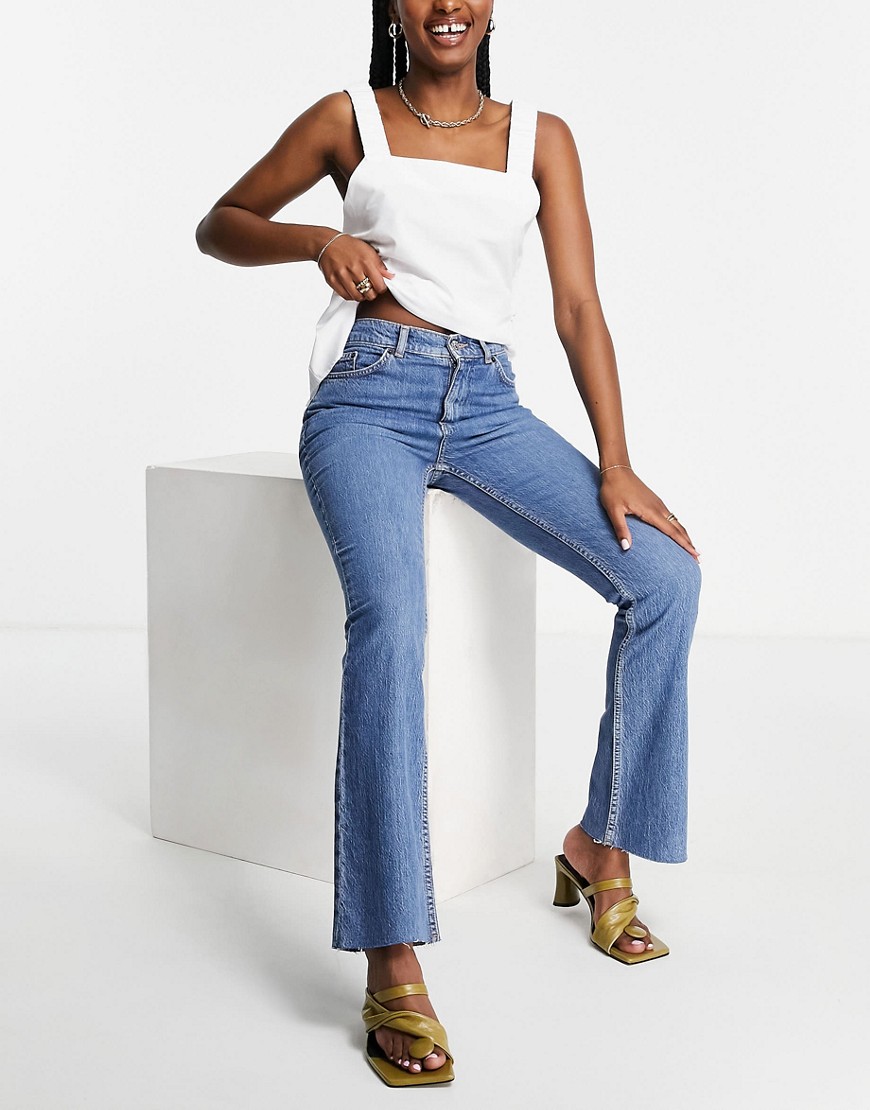 ASOS DESIGN high rise 70s stretch flare jeans in midwash