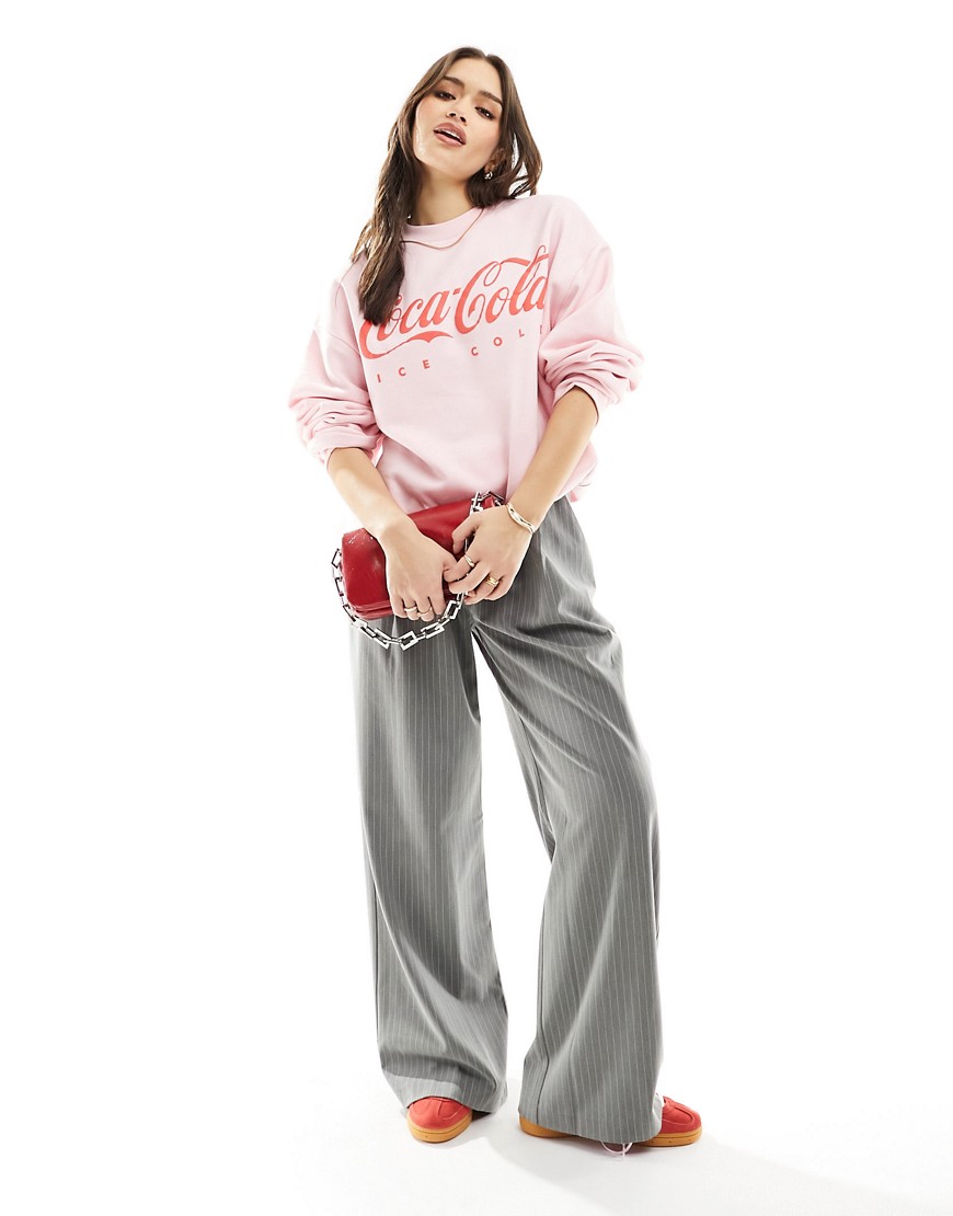 ASOS DESIGN oversized sweat with Coca-Cola license graphic in pink