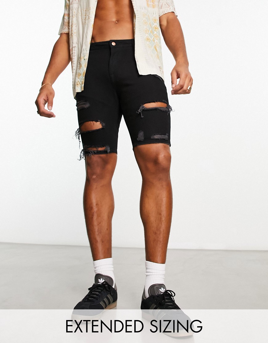ASOS DESIGN skinny regular length shorts in black with heavy rip