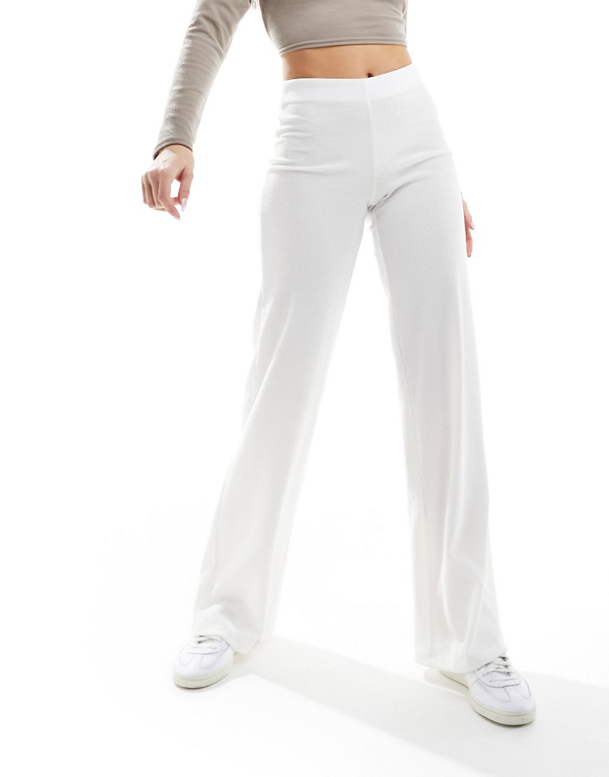 Bershka crinkle flared beach pants in white