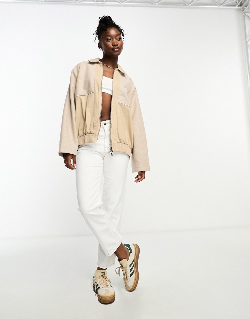 The Couture Club tweed paneled bomber jacket in beige