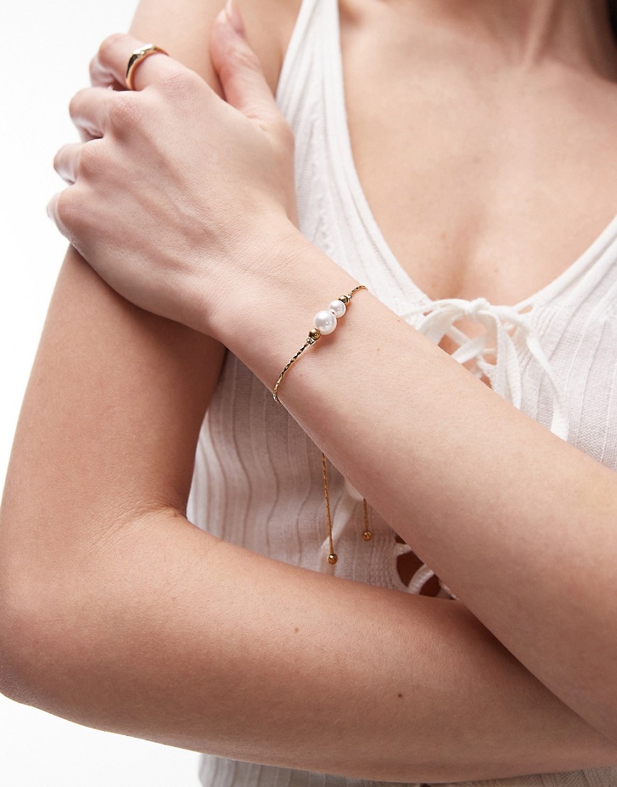Topshop Prin stainless steel bracelet with faux pearls in gold tone