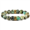 Crucible Jewelry crucible los angeles 12mm african turquoise bead stretch bracelet with gold ip stainless steel tribal accent beads