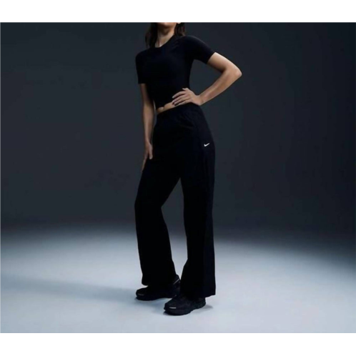 NIKE womens wind runner high waisted woven open hem pants in black