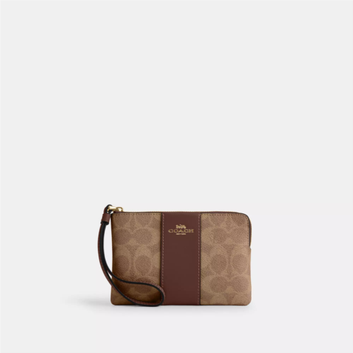 Coach Outlet corner zip wristlet in signature canvas with stripe