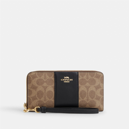 Coach Outlet long zip around wallet in signature canvas with stripe