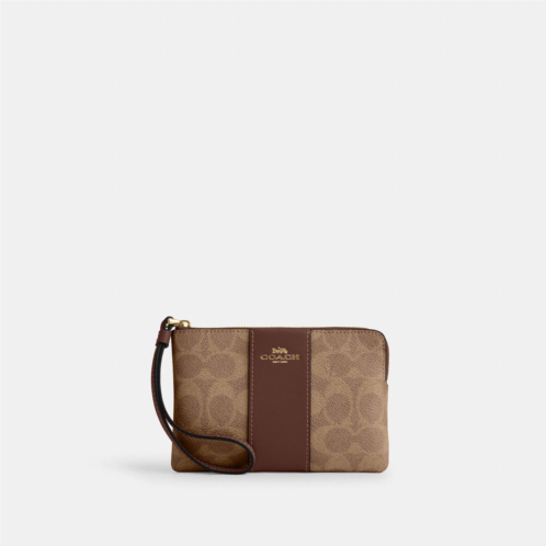 Coach Outlet corner zip wristlet in signature canvas with stripe