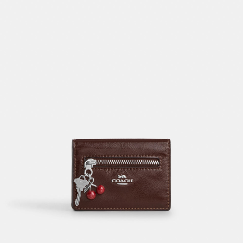 Coach Outlet card case with charms