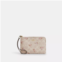 Coach Outlet corner zip wristlet in signature canvas with floral print